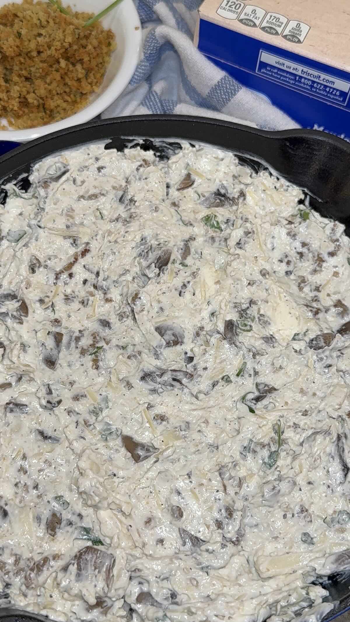 stuffed mushrooms with sausage mixture in baking dish