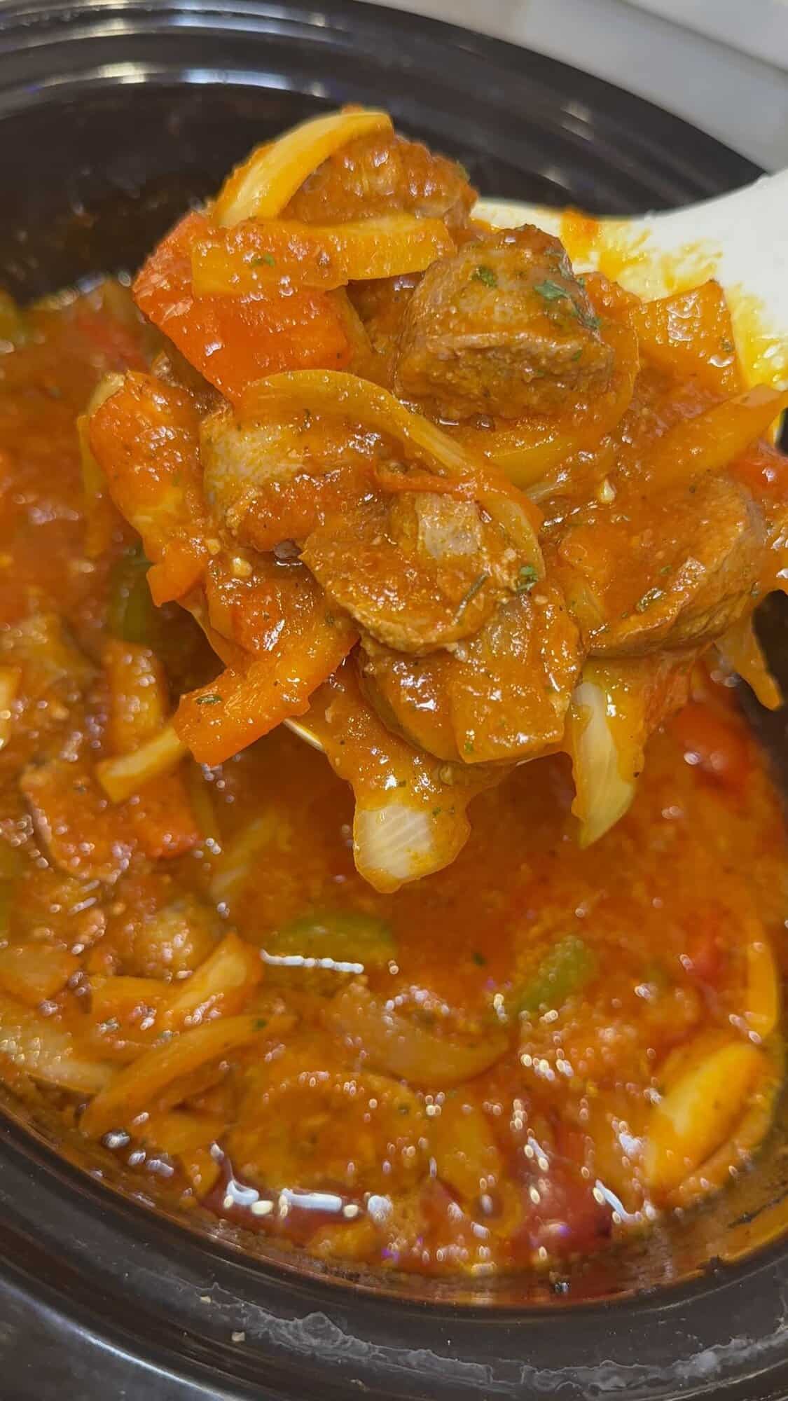 cooked sausage and peppers in the crockpot