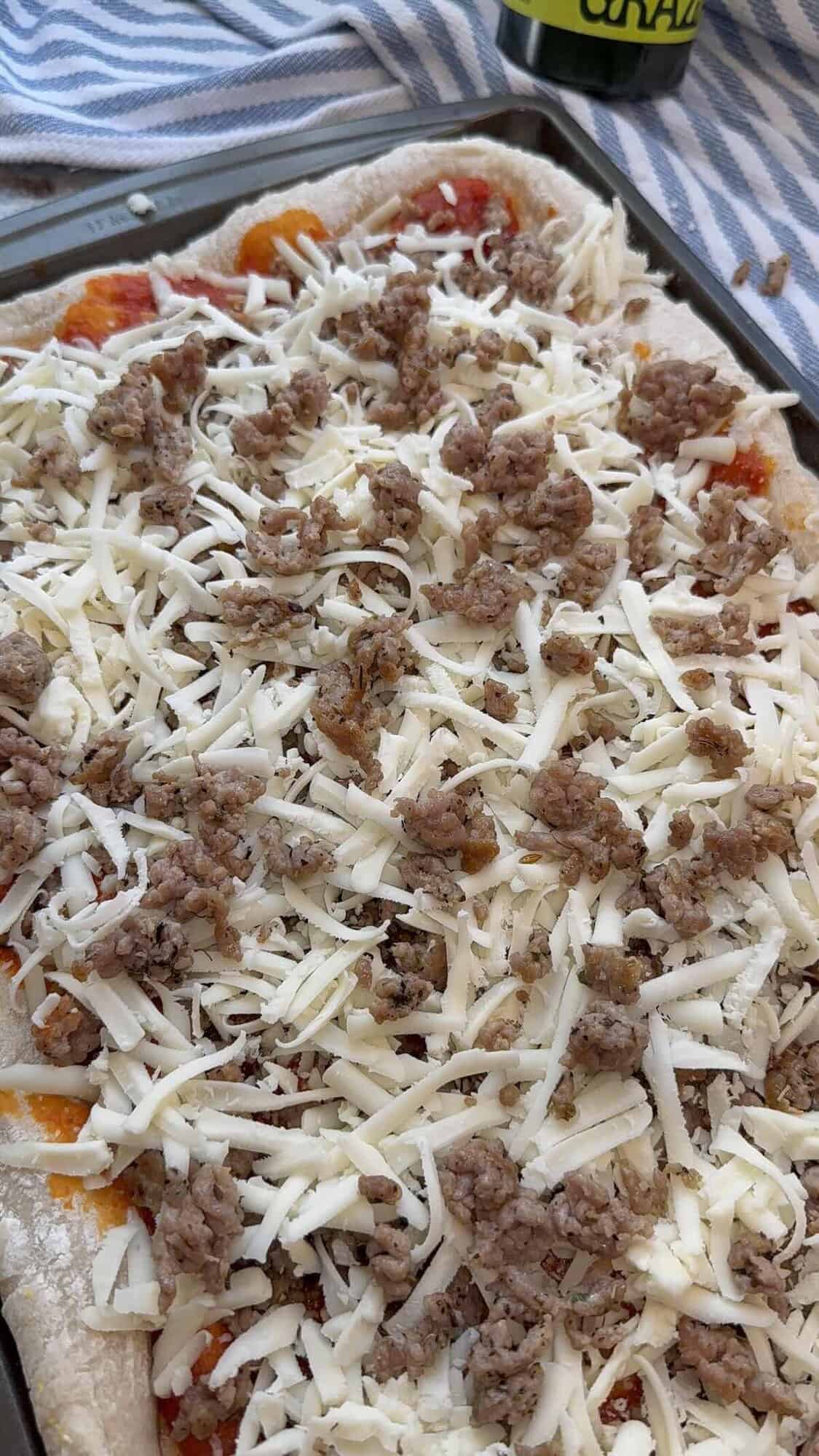 cafeteria pizza about to be baked