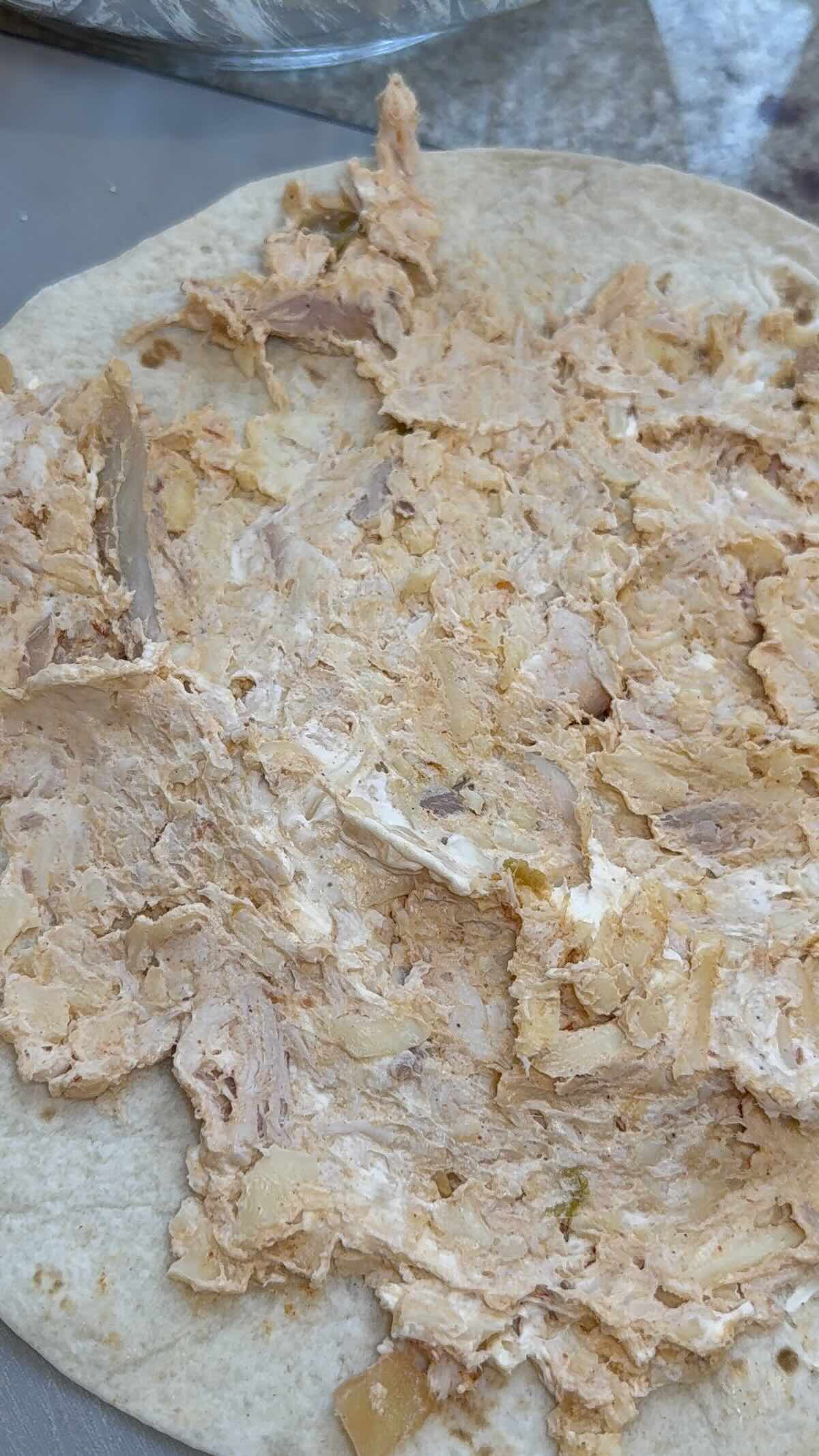 chicken taco pinwheel filling in the tortilla