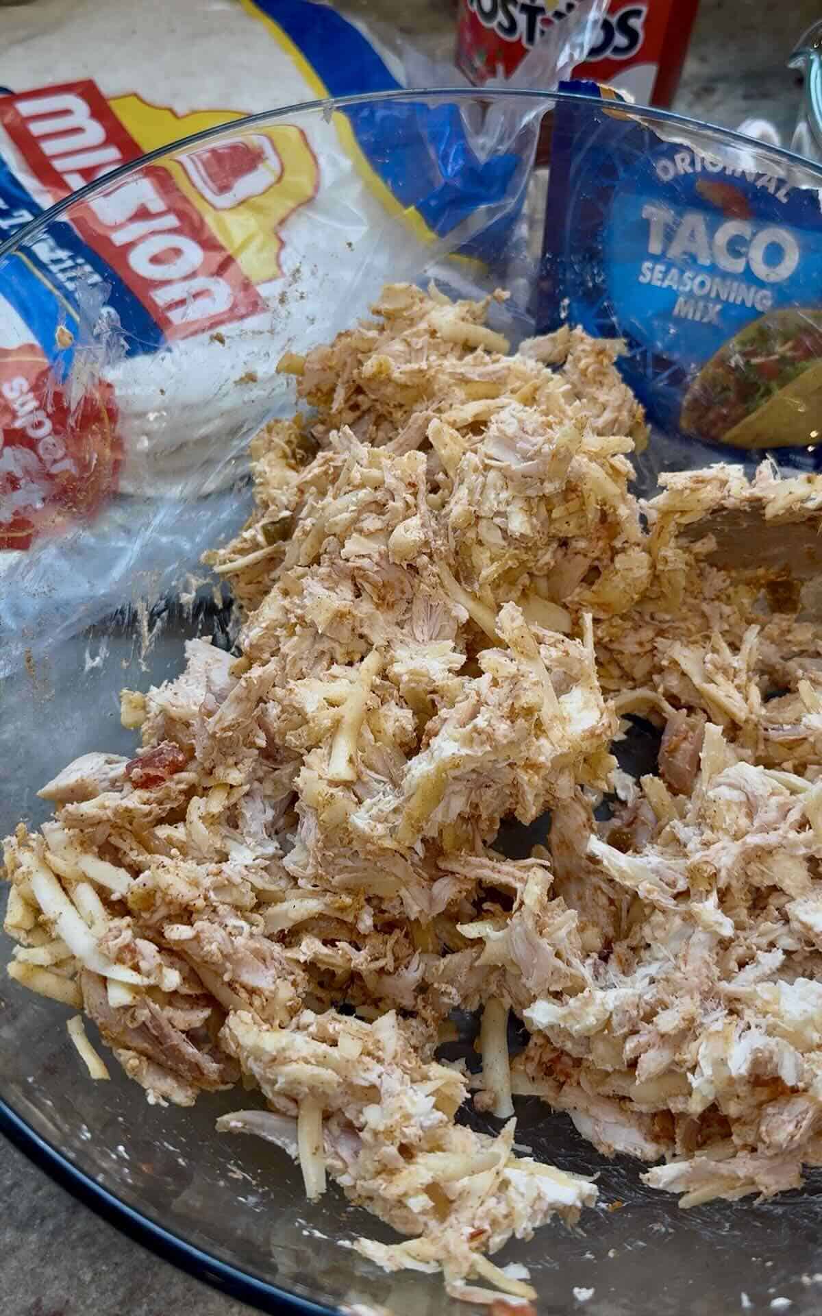 chicken taco pinwheel ingredients mixed together in a bowl