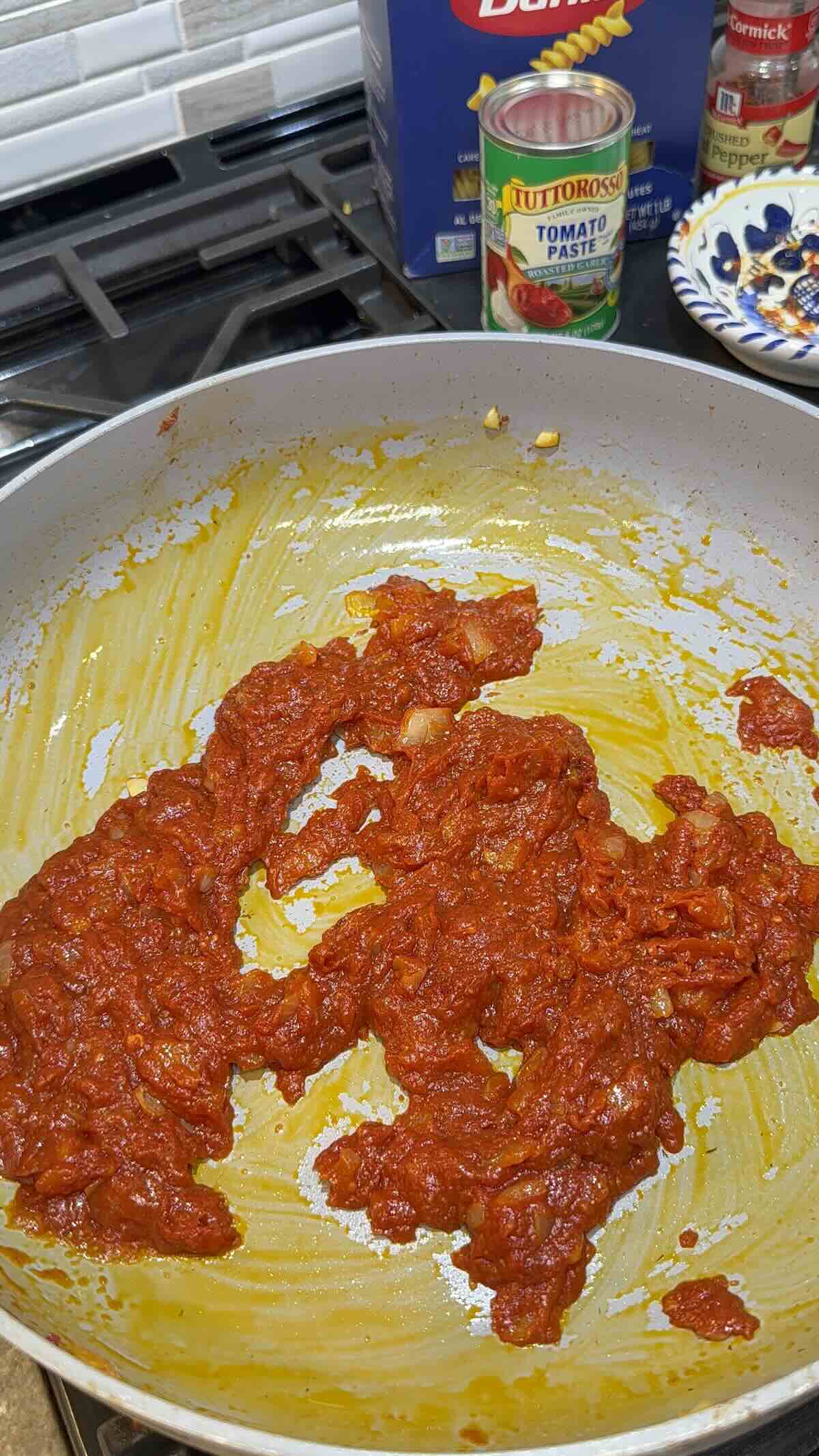 garlic onion and hot pepper flakes in skillet