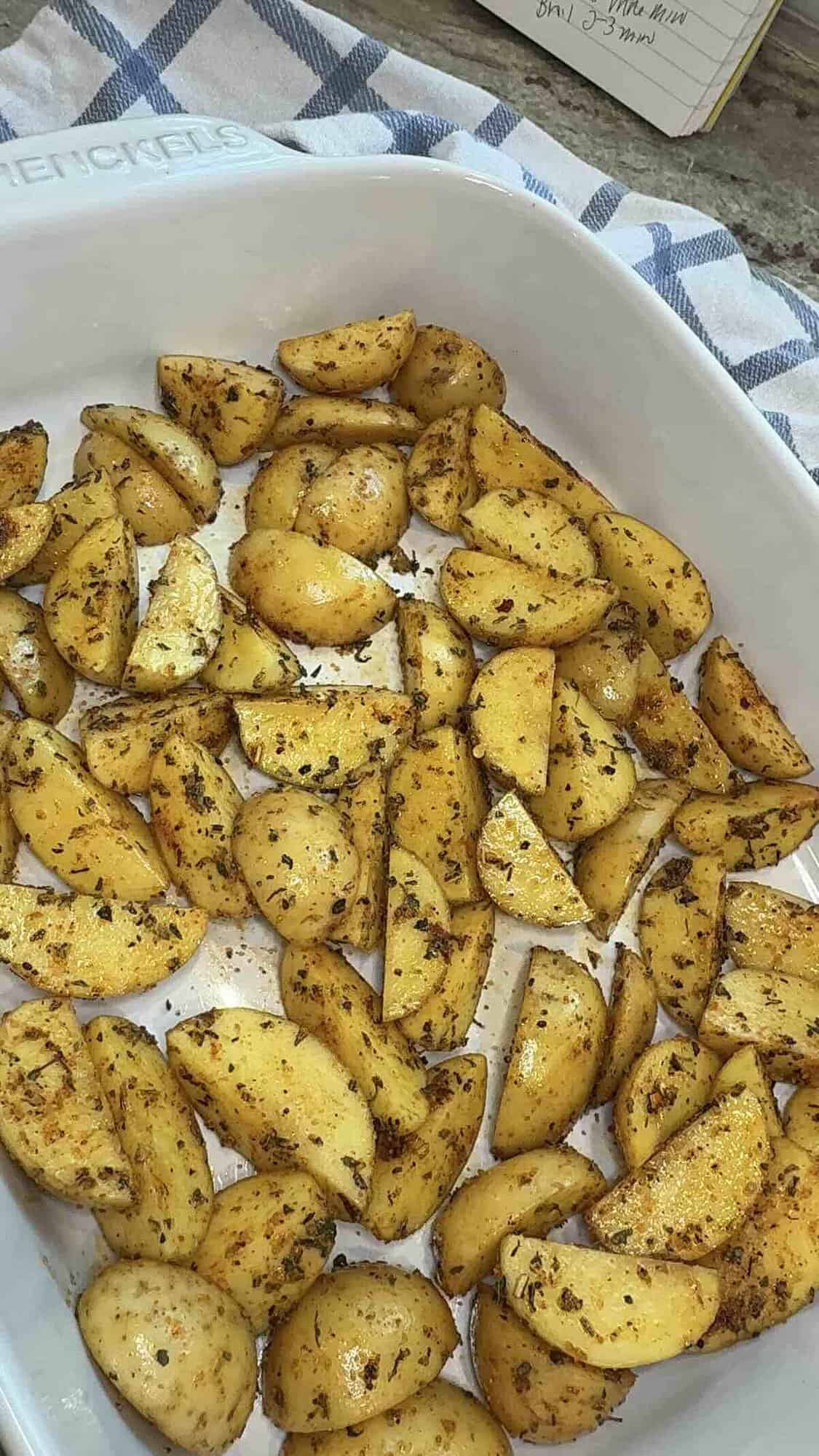 seasoned potatoes in baking dish