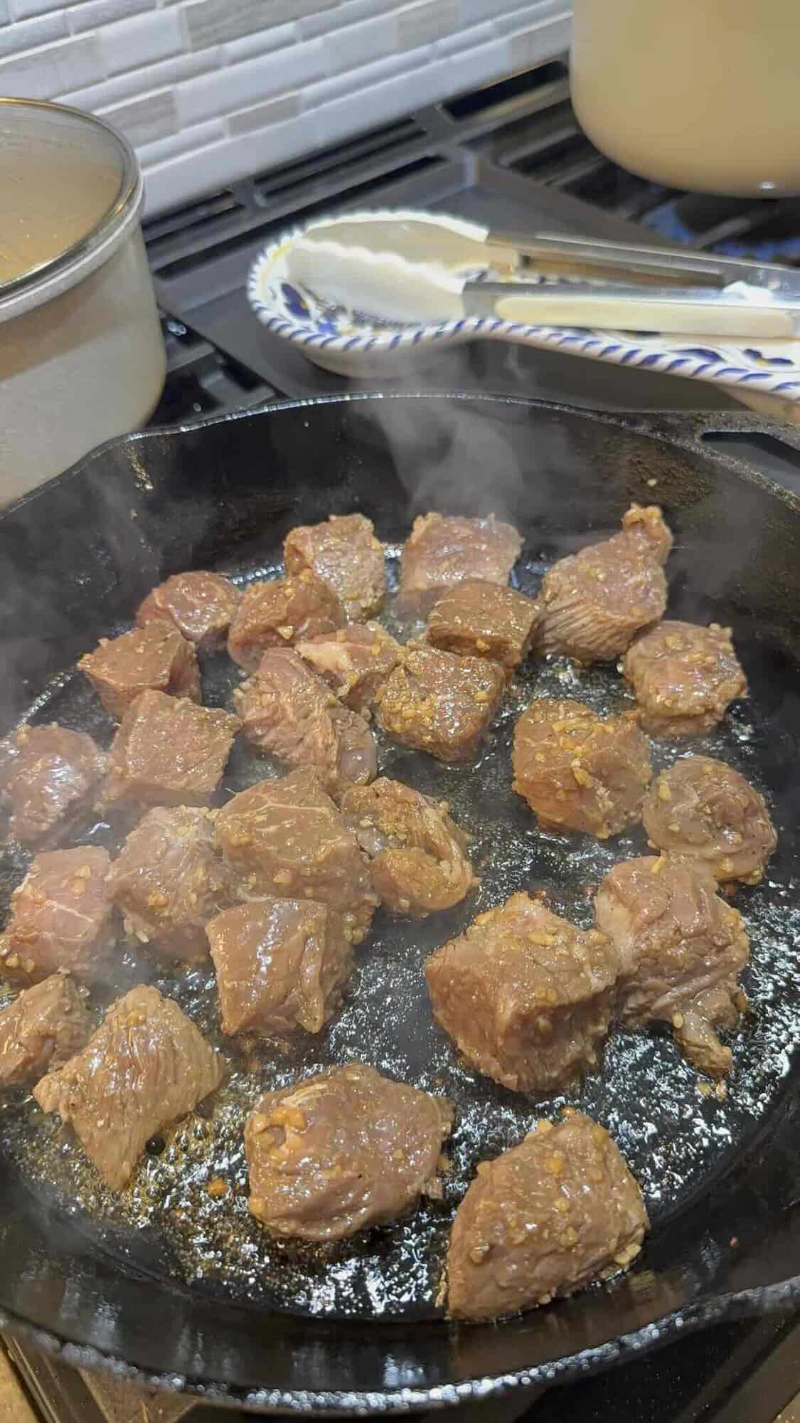 steak tips in cast iron skillet